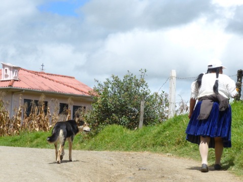 Indigenous woman of Ecuador with dog on one of our hikes